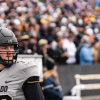 Camden Dempsey looks to the side while in full pads during a CU Football game