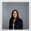 Marionne Sevilla poses in a headshot surrounded by a polaroid-style frame