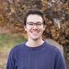 Hyde Weissenfluh smiling in front of a tree in autumn.