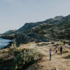 People stand on a coast line