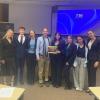 Professor Nunziato stands with the winning team at the 2024 Business Ethics Case Competition.
