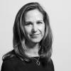 Jennifer Bixler, in black and white, against a gray background.