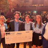 Luke Bille with the ClimateScaping team holding their award check