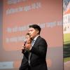 A student in the Business Leadership program speaks into a microphone while delivering a presentation as part of the program.