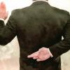 Ethics of Negotiation image of man crossing fingers