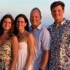 Michael Cain with his wife and children at the beach.