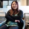 Christina in a chair in the Deming Center's new offices.