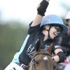 Cecily Coors celebrates on her horse after scoring a goal.