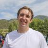Connor Lacey at an outdoor event. The mountains are visible in the background.