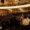 Graduates in a packed Macky Auditorium