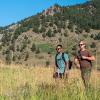 Two veterans hiking in Chautauqua park. The foothills of the Rocky Mountains can be seen in the back.