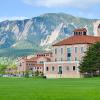 The Koelbel Building on the CU Boulder campus, with the Flatirons in the background.