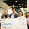 NICC Winners Holding Check