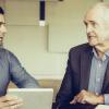 Senior worker talking with more junior person