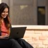 student working outside on laptop