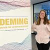 Alexis Grubman in front of the Deming Center for Entrepreneurship sign
