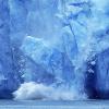 An iceberg melting into the ocean.