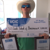 Leeds team member and MBA candidate Nick Thigpen holds up check from winning VCIC regionals