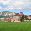 The Koelbel building with the Flatirons in the background