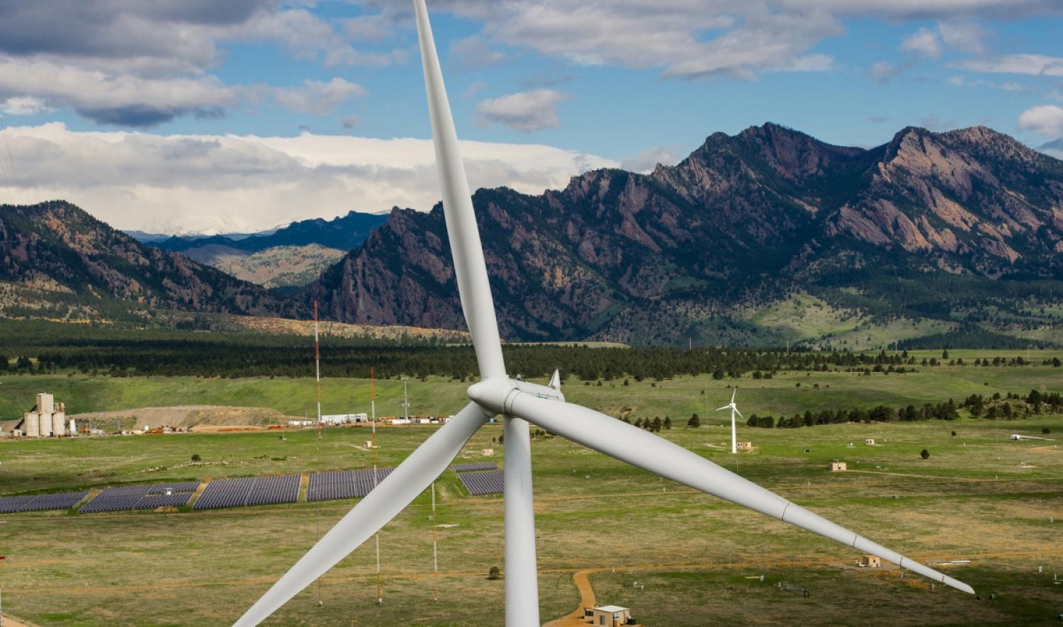 Wind farm with the Rocky Mountains in the background
