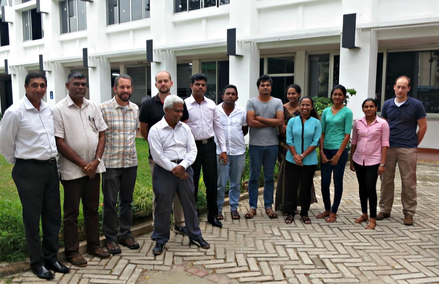 training attendees and instructor outside the training building in Colombo
