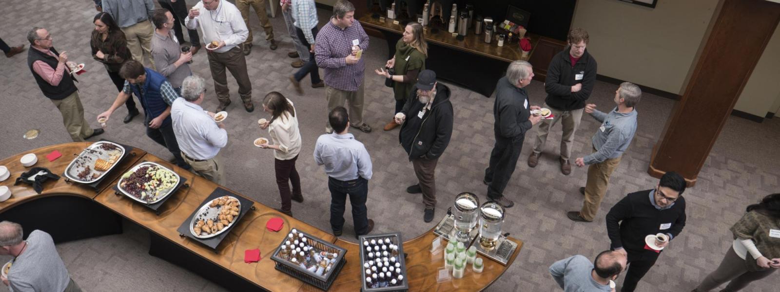 view of user group meeting attendees networking during break from above