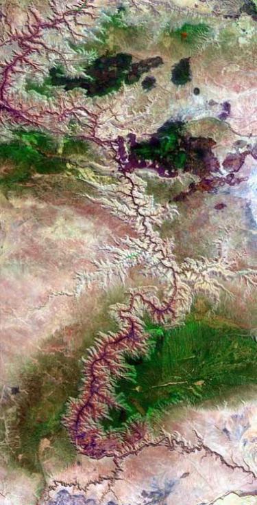 Aerial of hundreds of miles of CO river through grand canyon in AZ