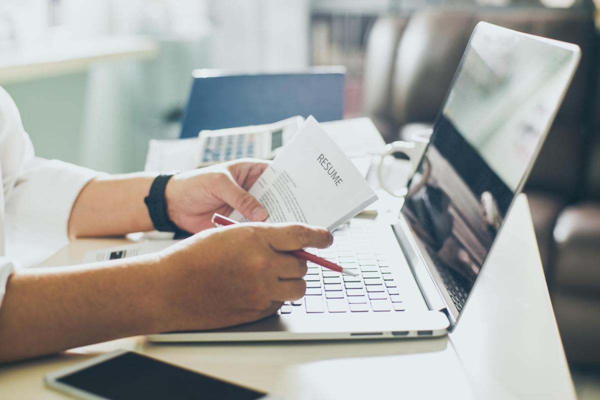 person holding a resume