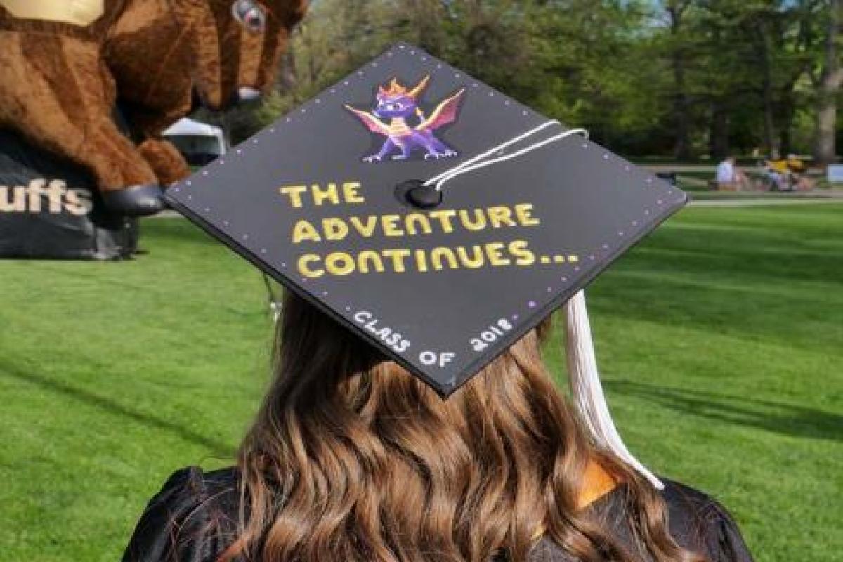 graduate in cap and gown