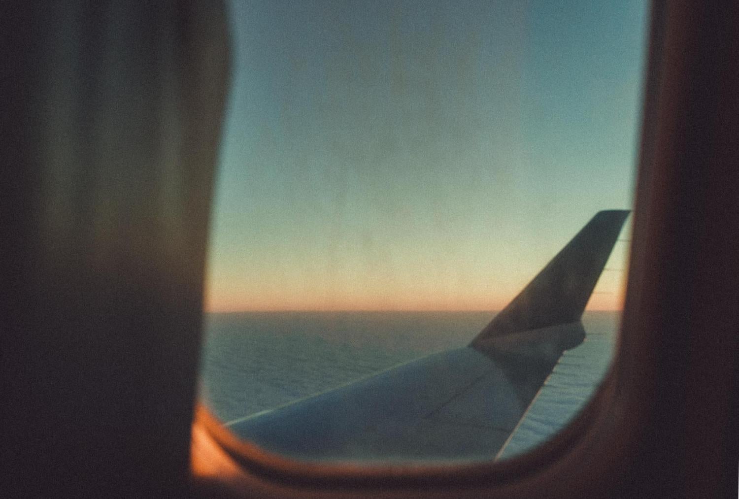 wing of an airplane over water