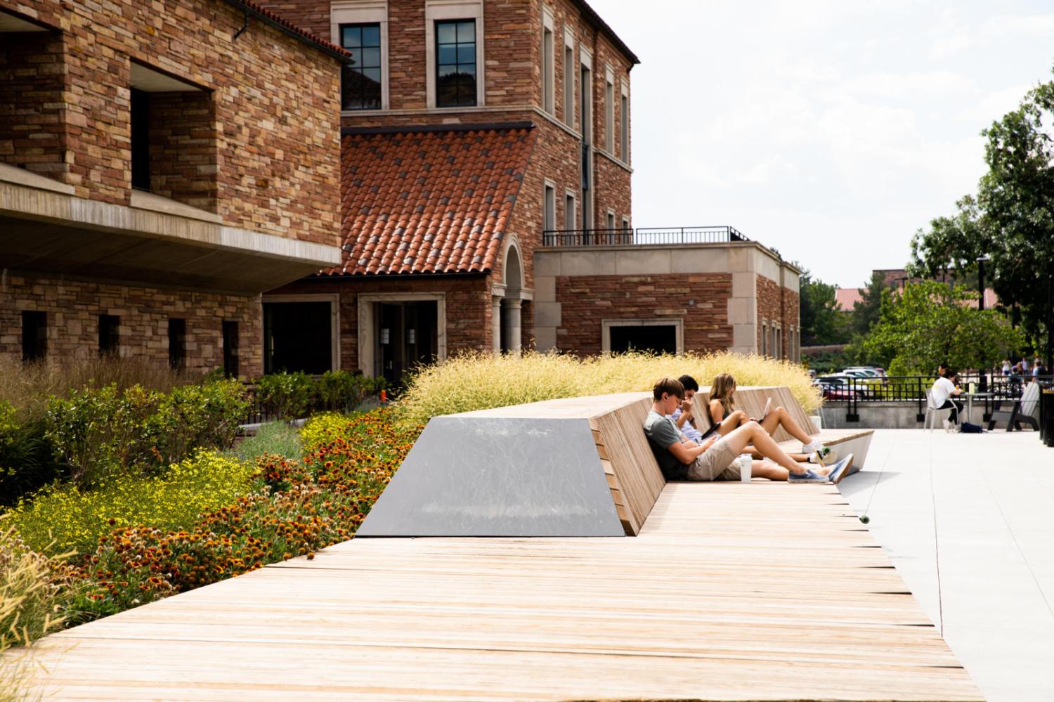 students sitting outside