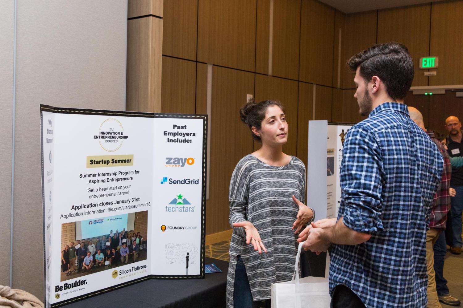 student talking with an employer