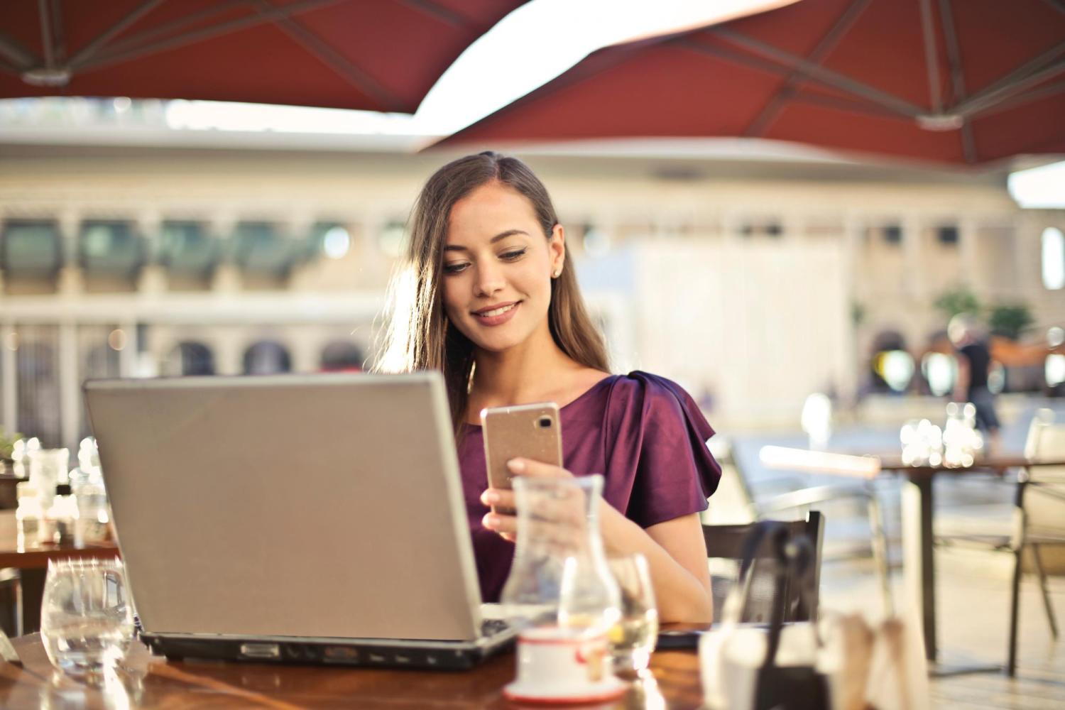 woman on a computer and cellphone