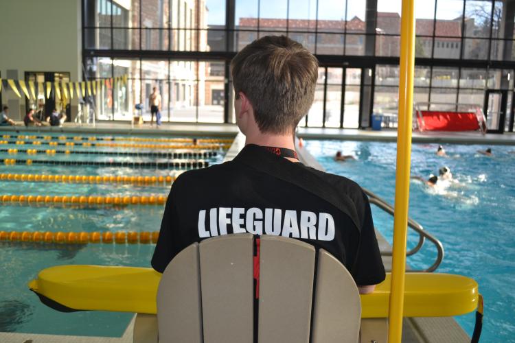 lifeguard watching pool