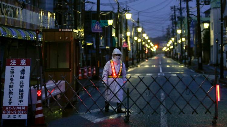 Fukushima area with man in protective suit.