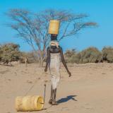 A person walking away from a groundwater pump station in Turkana, Kenya. 