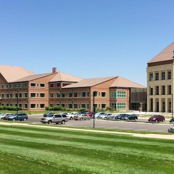 SEEC building on the CU Boulder East Campus with grass in front of it.