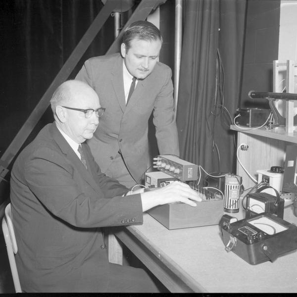 Helms in CU Boulder's photometric lab with an identified person in 1967.