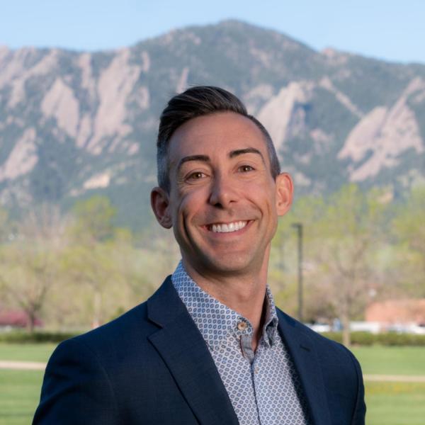 Wil Srubar with the mountains blurred in the background.