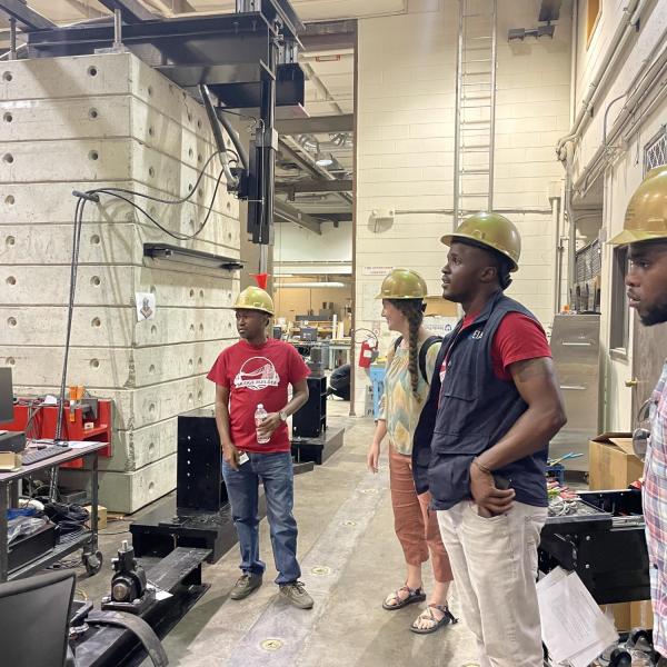 EIA visitors in  hardhats at site visit
