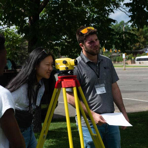 Conference participants using survey equipment