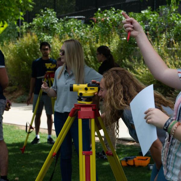 Conference participants using survey equipment