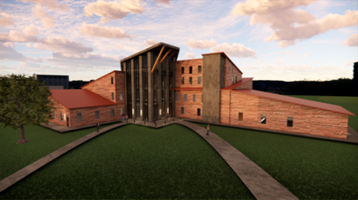Sandstone brick exterior building with glass tower from the central bottom to top.