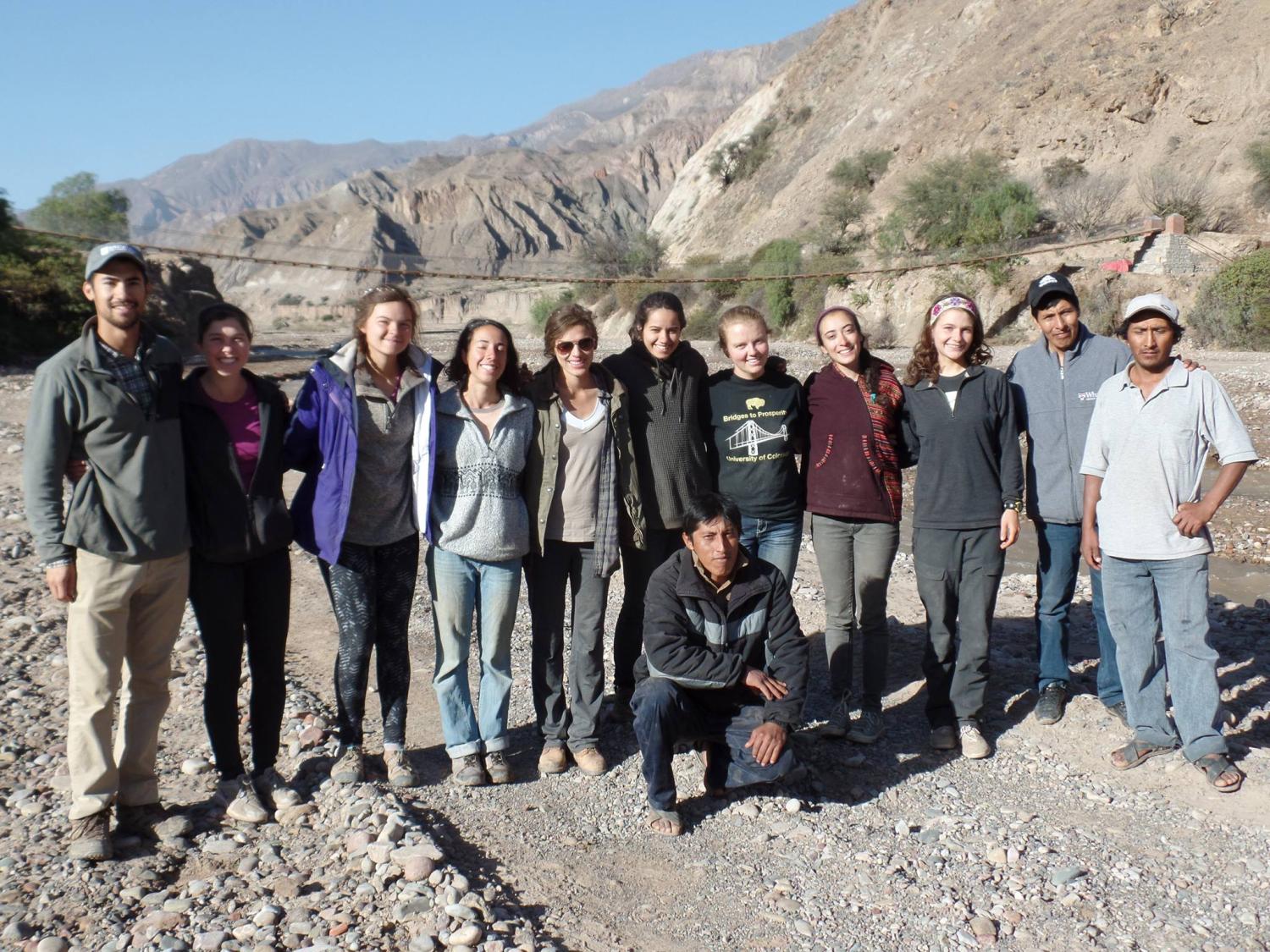 CU Bridges to Prosperity team with bridge in background