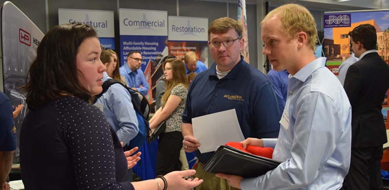 A student speaks with an employer at last year's career fair.