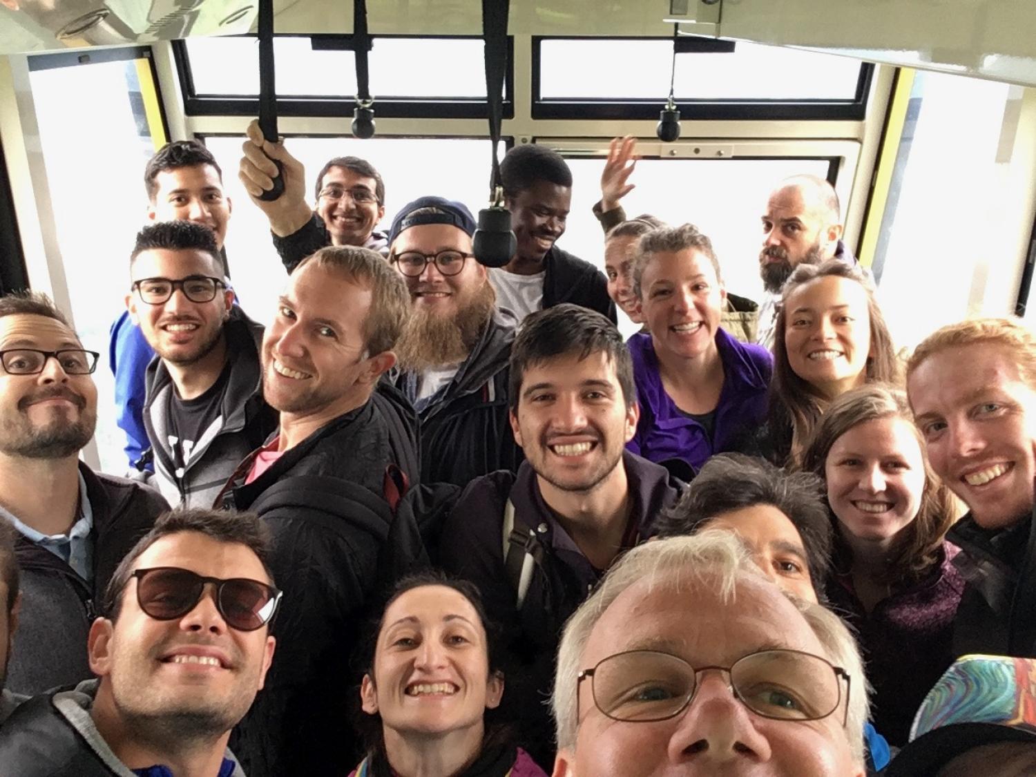 Participants in the Global Intensive course in a selfie on a bus.