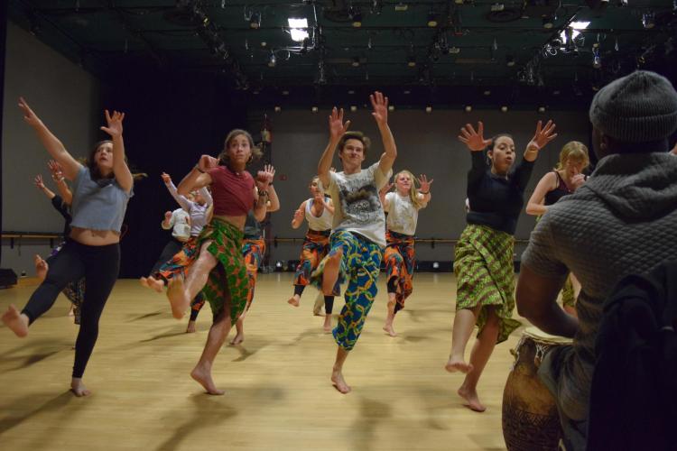 Michael dancing with his African dance classmates