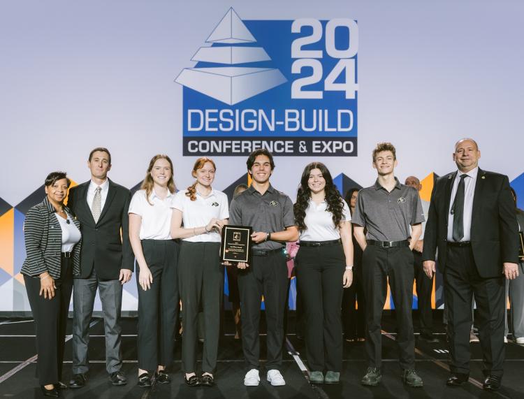 CU Boulder team holds their trophy at the Design-Build Conference & Expo.