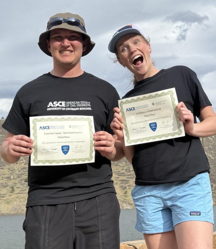 Concrete Canoe president and captain holding their awards