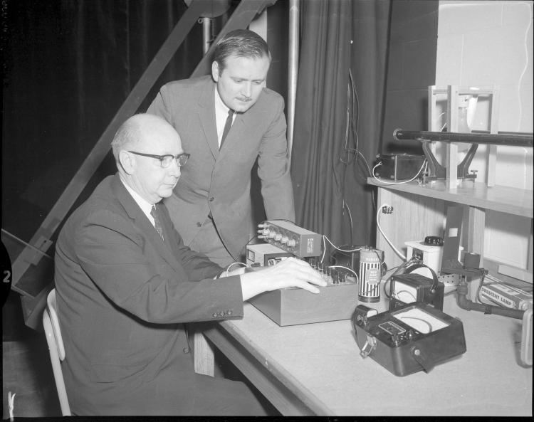 Helms in CU Boulder's photometric lab with an identified person in 1967.